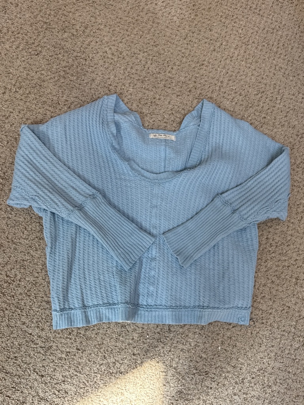 Cropped light sweater